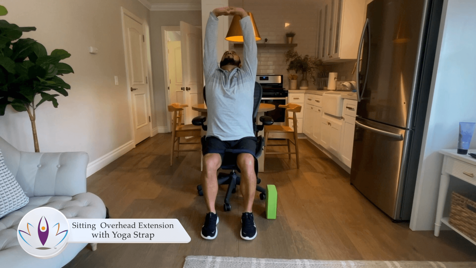 Sitting Overhead Extension with Yoga Block
