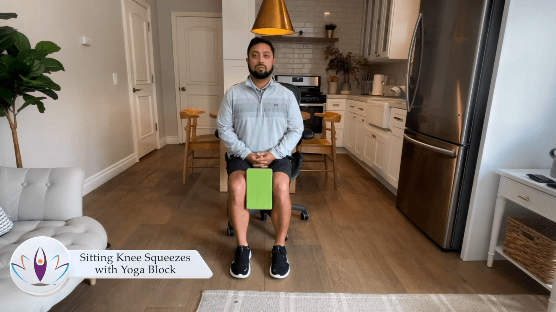 Sitting Knee Squeezes with Yoga Block