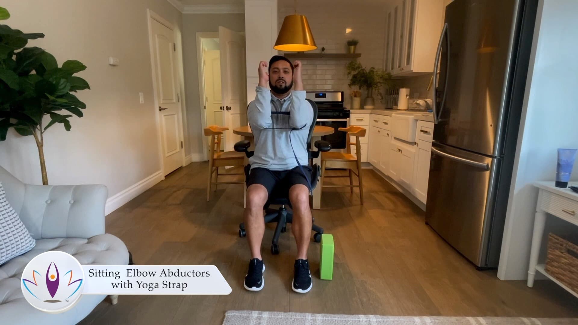 Sitting Elbow Abductors with Yoga Strap
