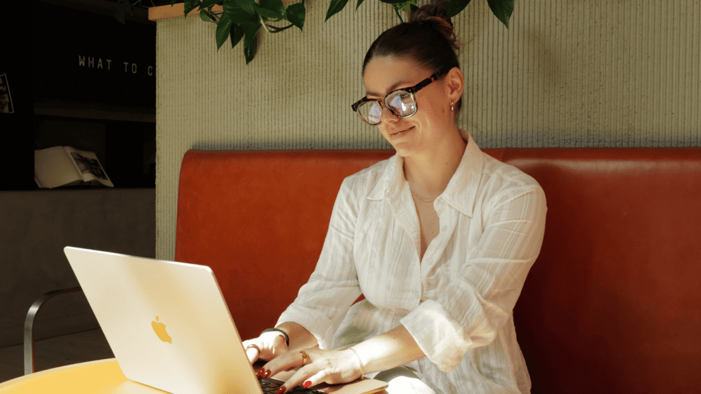 Creator working at her laptop